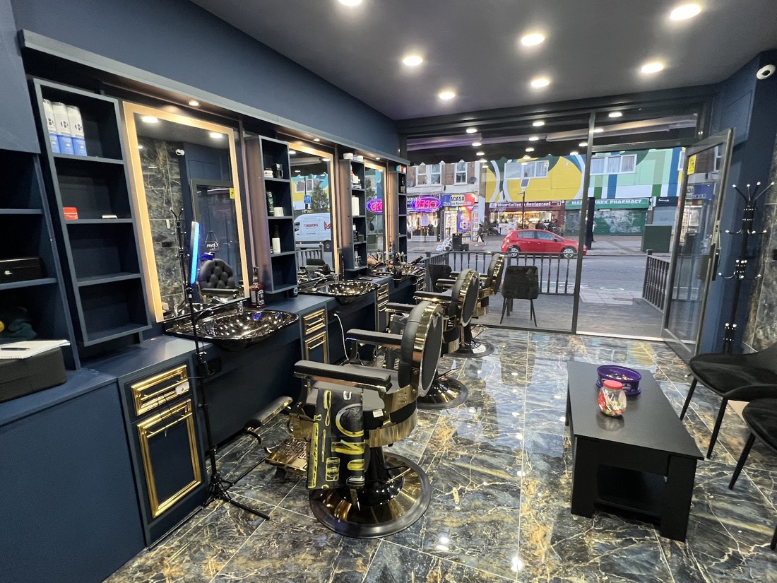 View from inside Aaron Barber onto Romford Road, Manor Park
